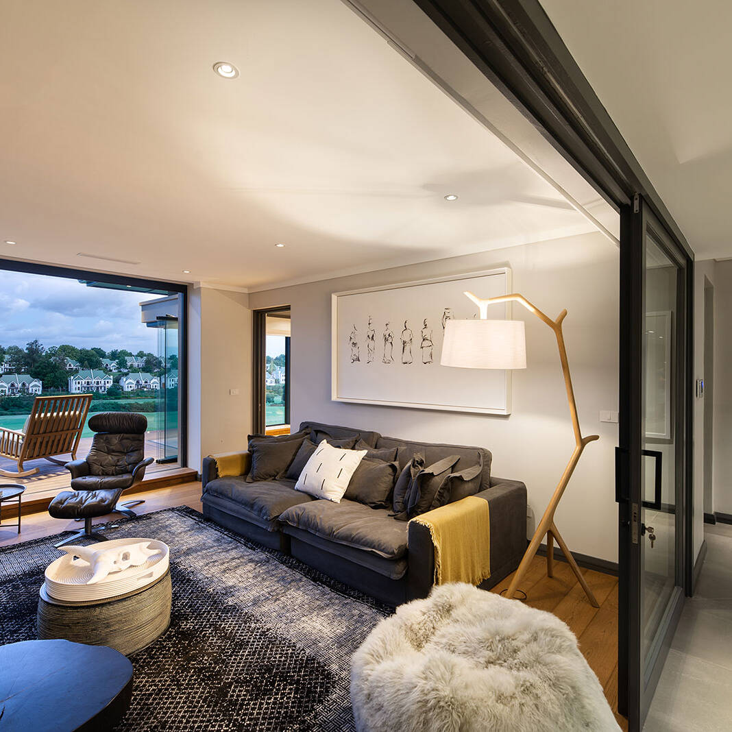 First floor lounge opening to balcony with views across Fancourt Golf Estate