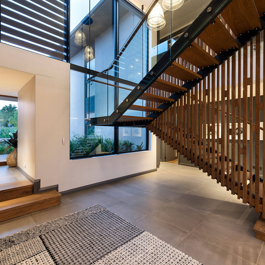 Central staircase and lobby area in contemporary Fancourt house
