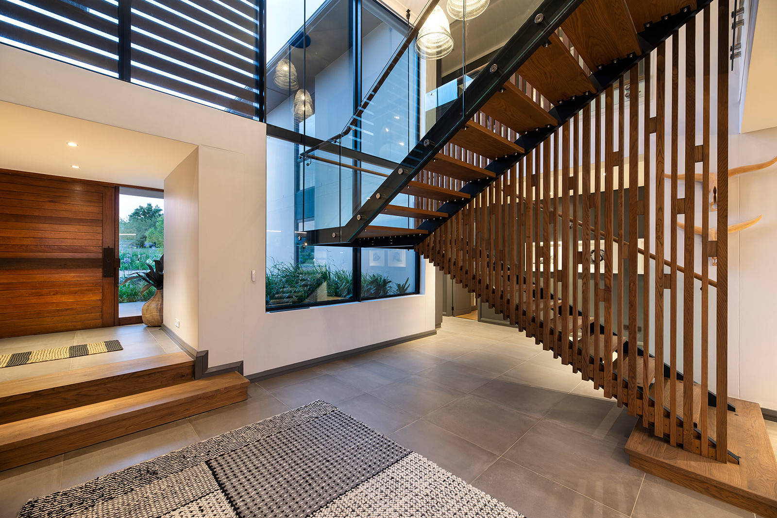 Central staircase and lobby area in contemporary Fancourt house