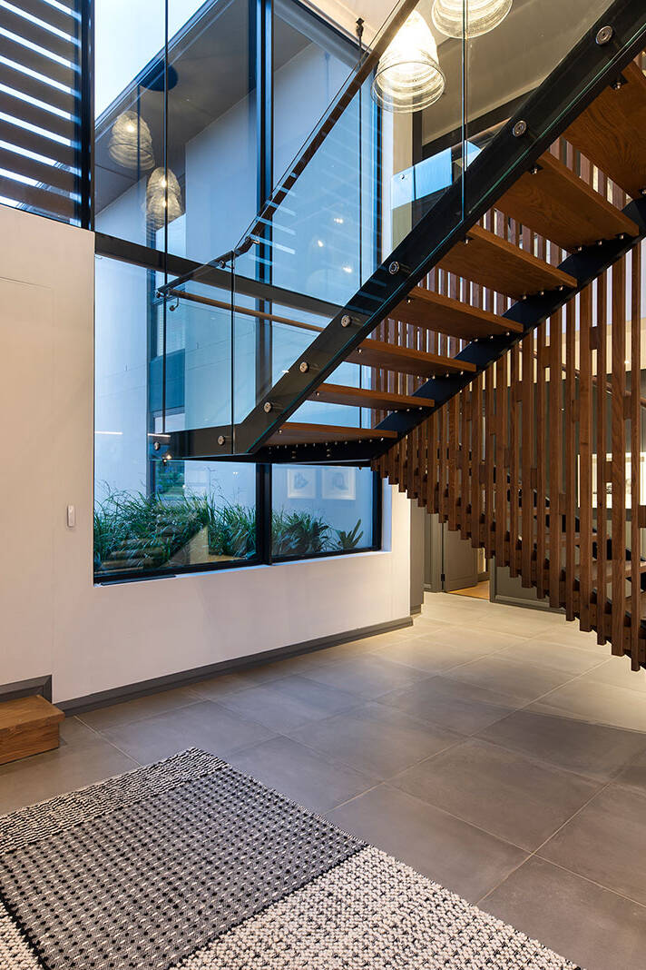Central staircase and lobby area in contemporary Fancourt house