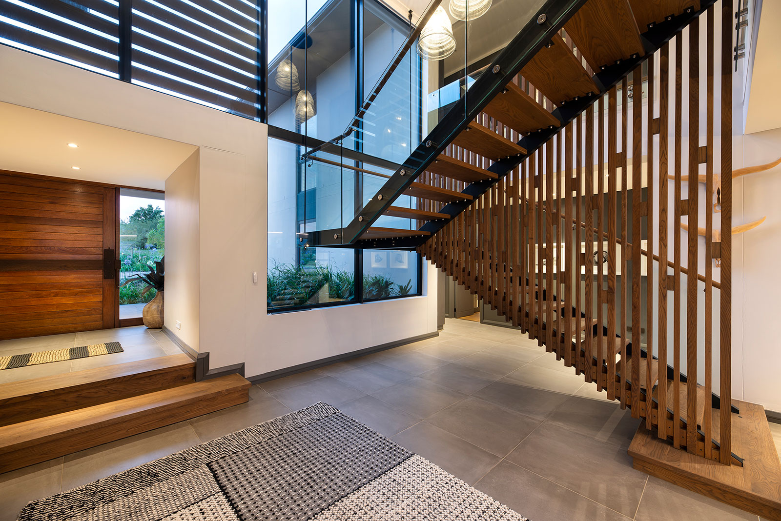 Central staircase and lobby area in contemporary Fancourt house