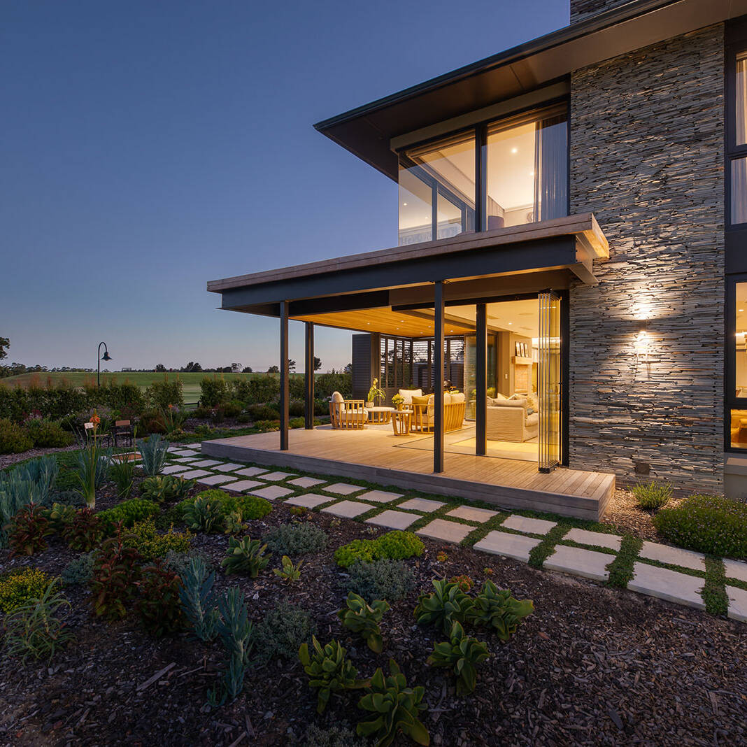 Covered patio lounge opening to garden with timber soffit and screens, The Garden Route South Africa
