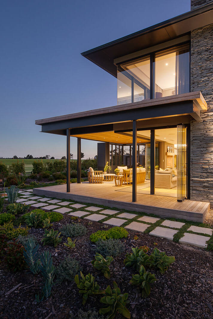 Covered patio lounge opening to garden with timber soffit and screens, The Garden Route South Africa