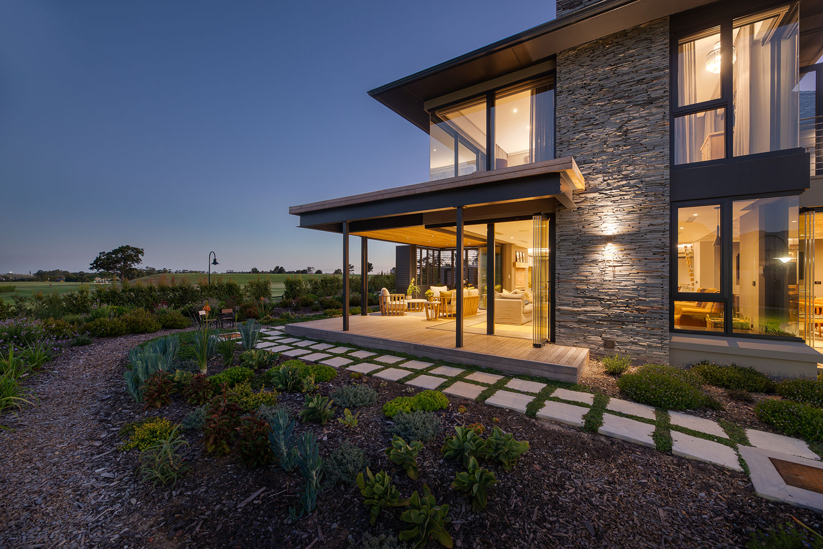 Covered patio lounge opening to garden with timber soffit and screens, The Garden Route South Africa