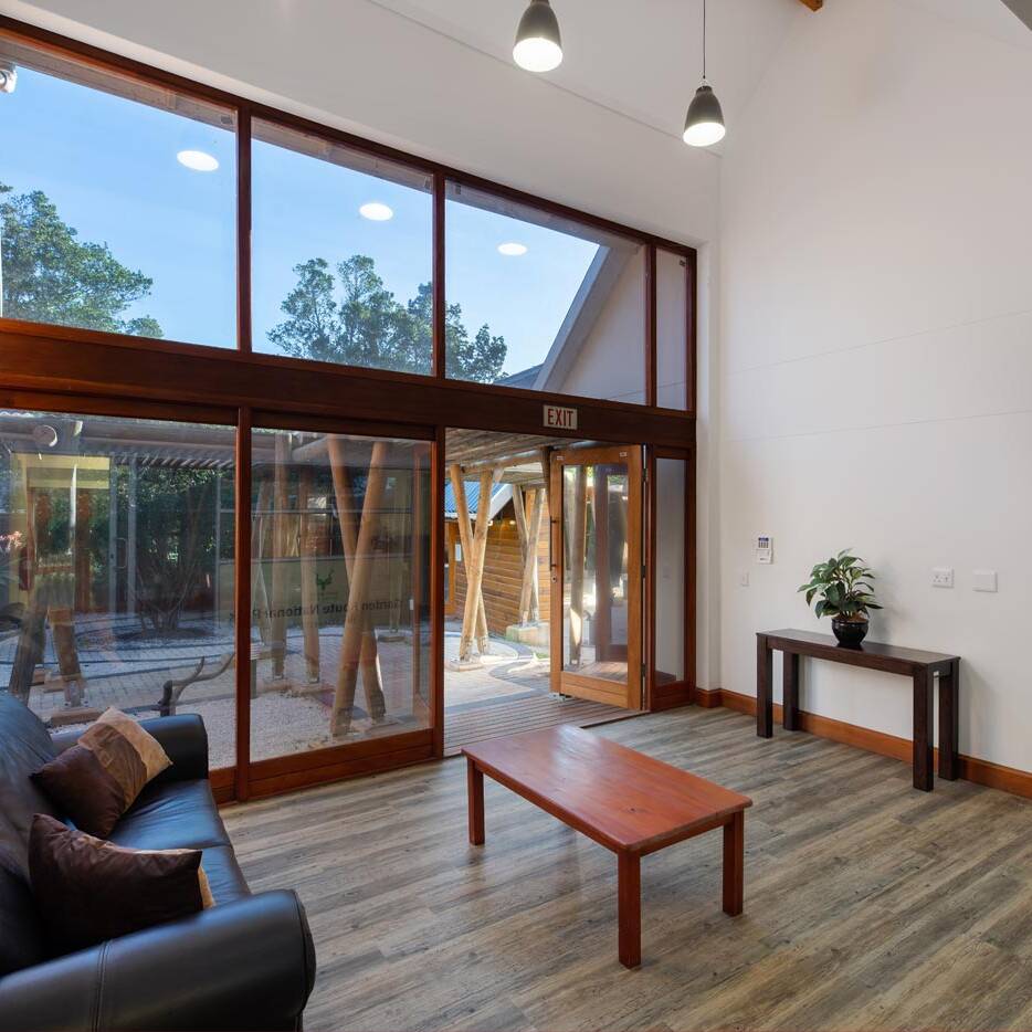 Reception seating area facing courtyard and entrance to boardroom wing