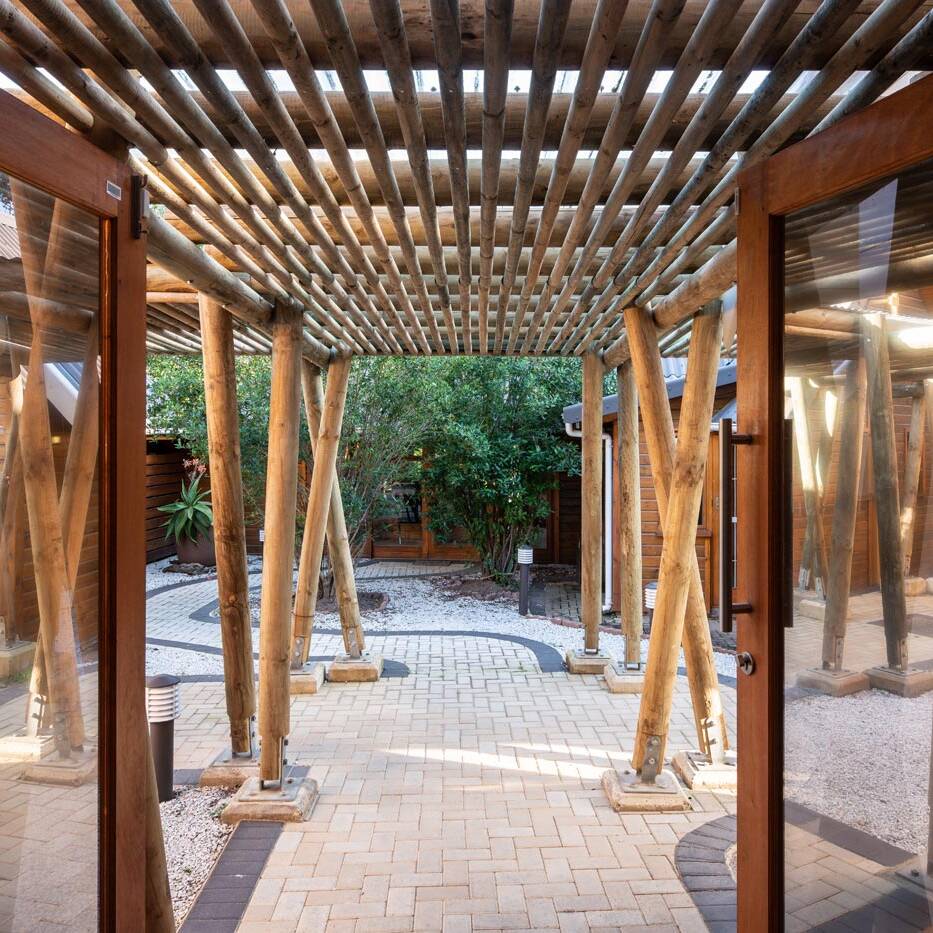 Timber pergola walkway and courtyard paving at administrative offices
