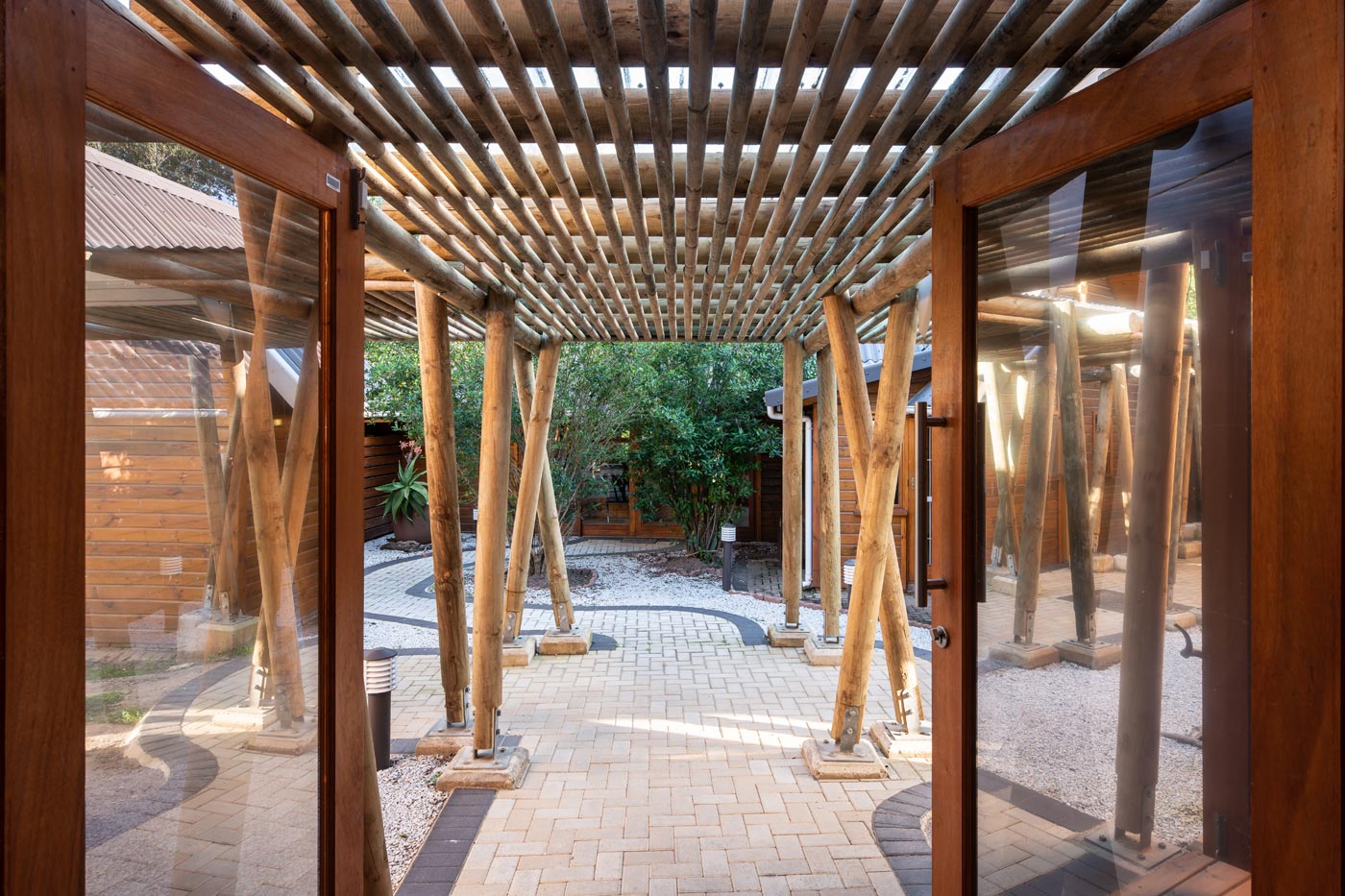 Timber pergola walkway and courtyard paving at administrative offices