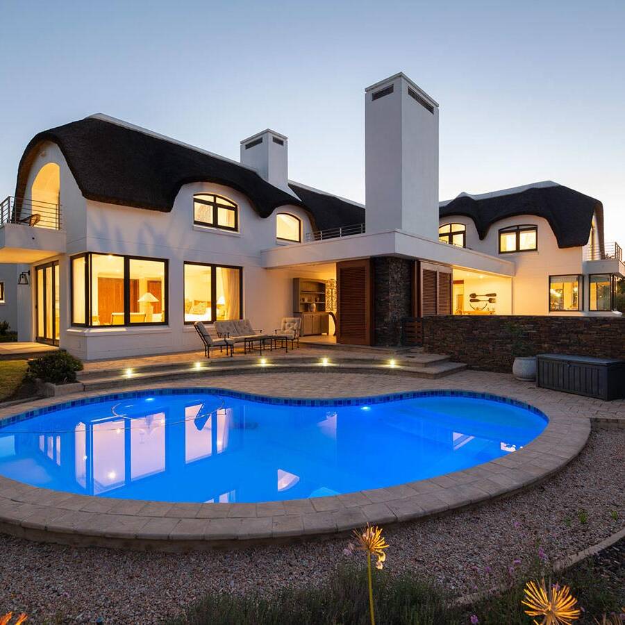 Exterior view with pool, luxury villa designed by FC Holm