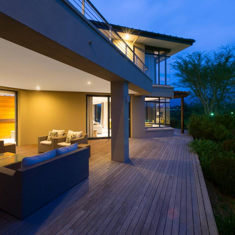 Wraparound timber deck with covered terrace and garden outlooks