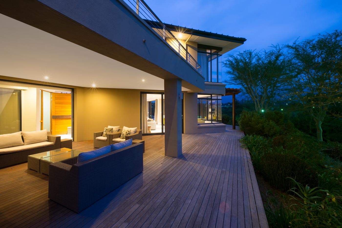 Wraparound timber deck with covered terrace and garden outlooks
