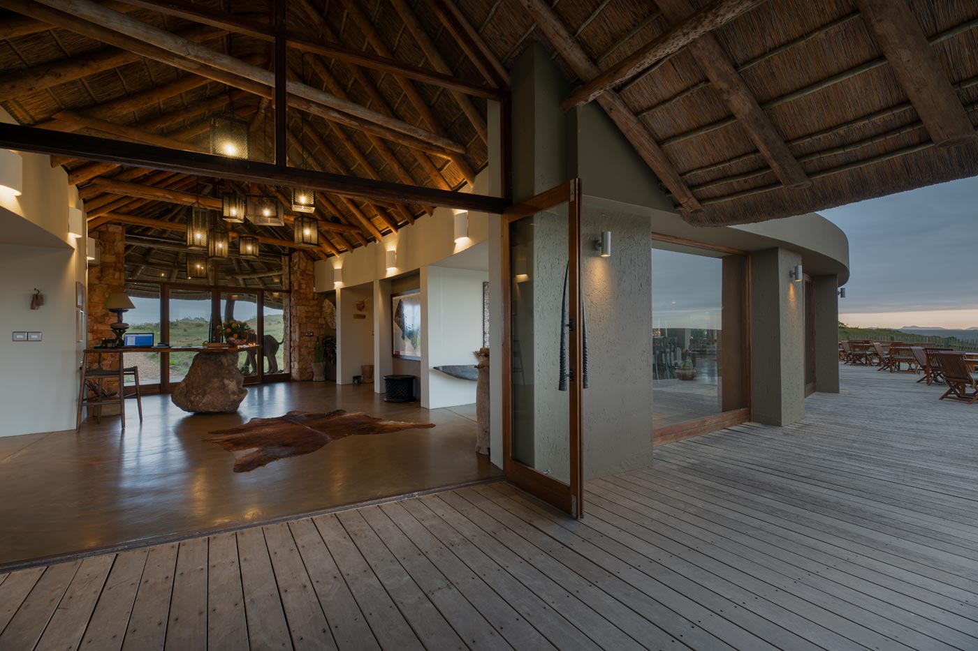 Entrance veranda with open glass doors and timber ceiling leading to the reception area