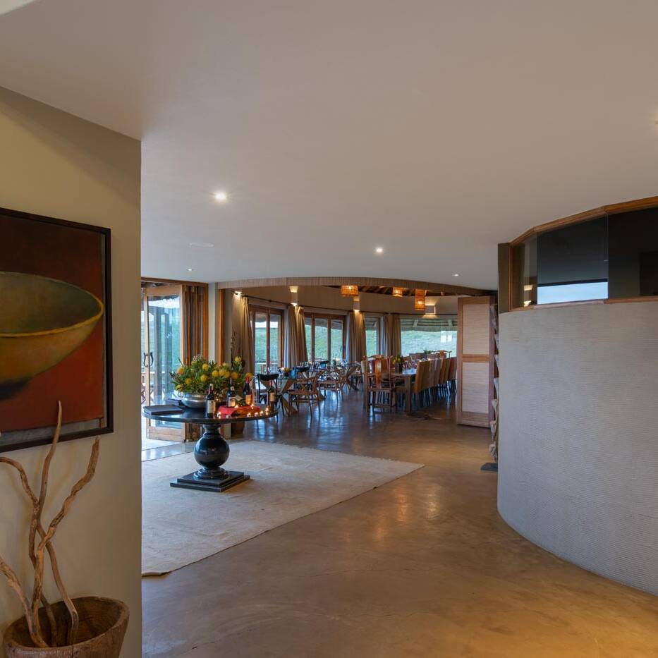 Reception corridor with artwork leading to the dining room and terrace
