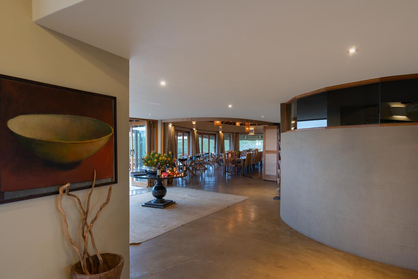 Reception corridor with artwork leading to the dining room and terrace