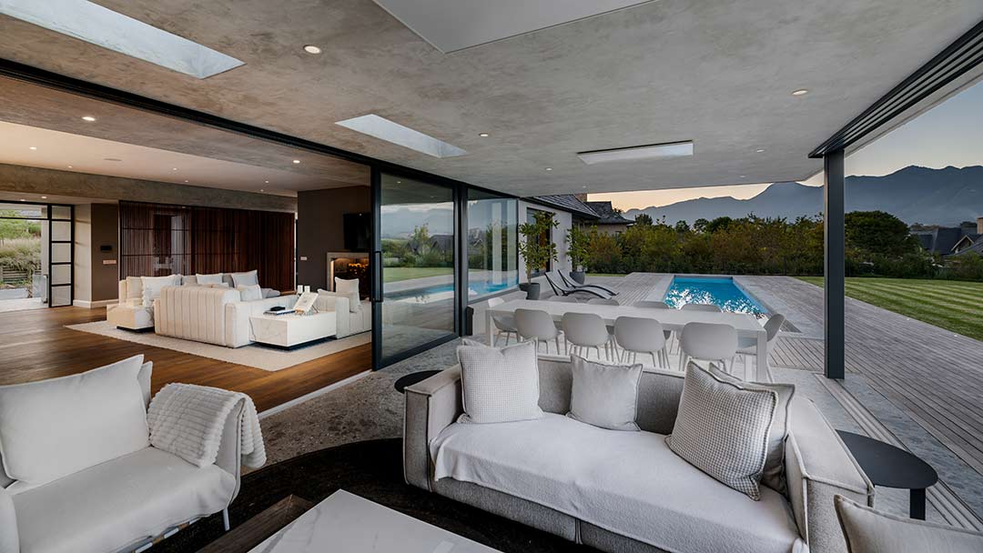 North-east elevation of House 3002 with long roofline and sliding doors to pool