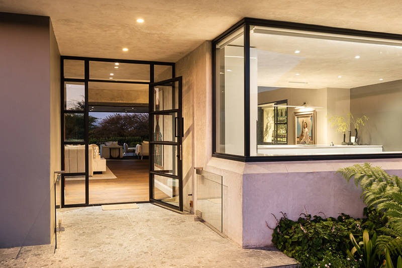 Twilight view of a Fancourt villa exterior