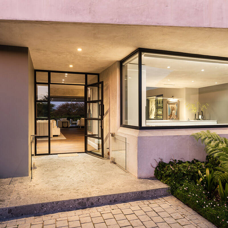 Twilight view of a Fancourt villa exterior