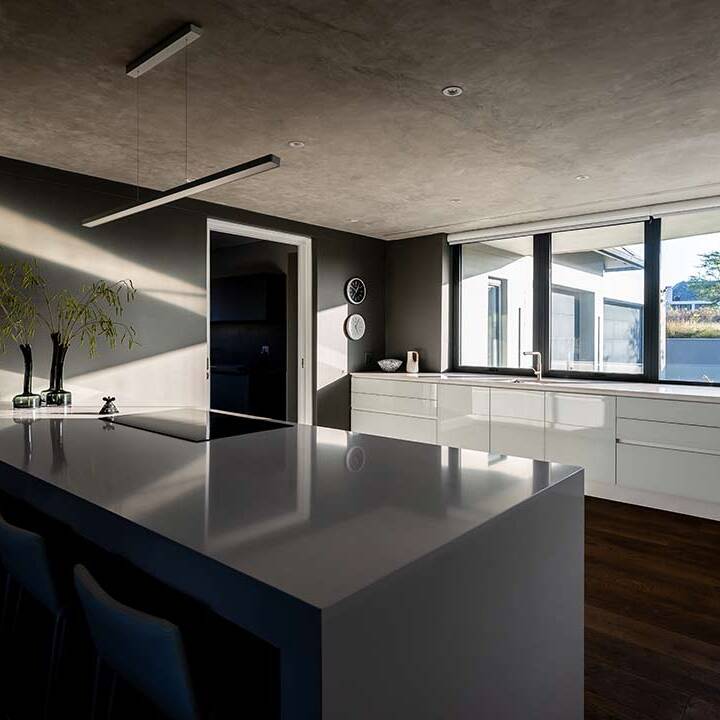 Minimal kitchen with large island, linear fittings and garden outlook, House 3002