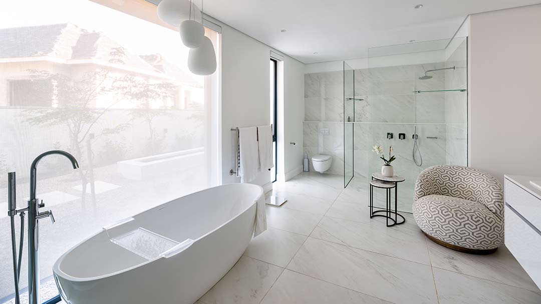 Light-filled master bathroom with freestanding tub and walk-in shower, House 3002, George