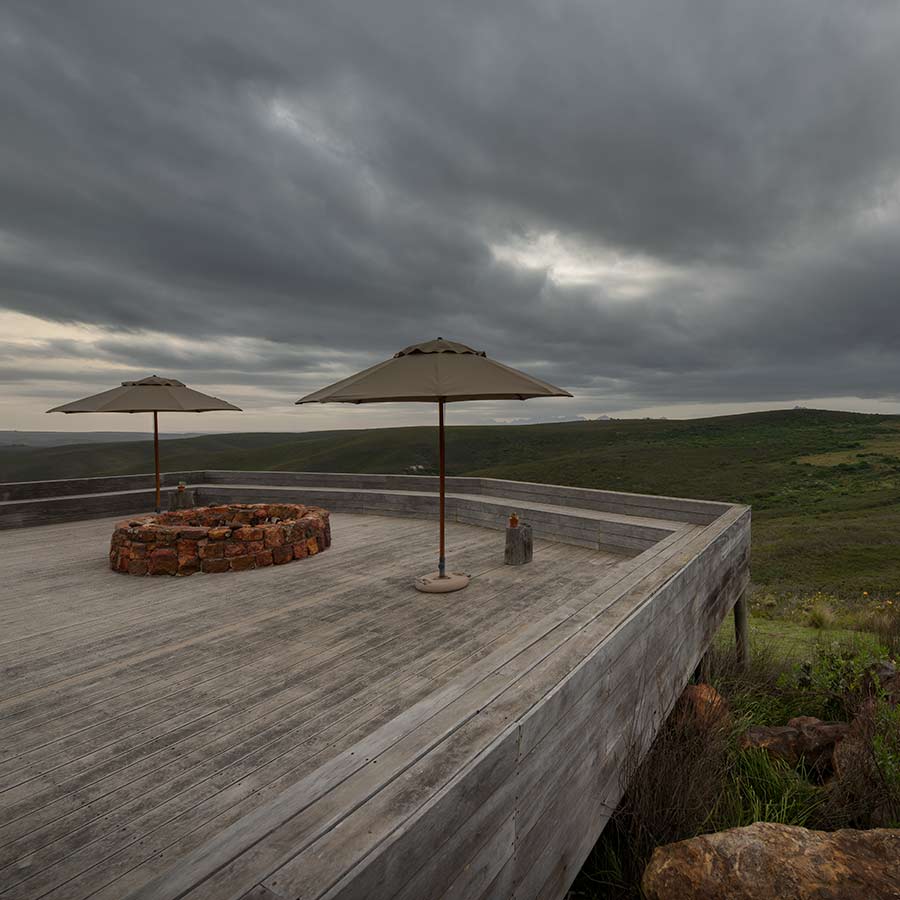 Safari lodge architecture, pool deck at sunset