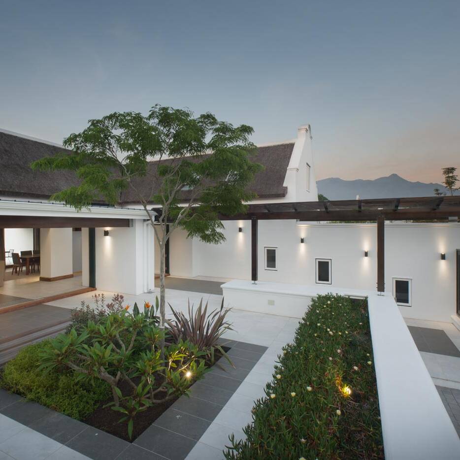 Modern home courtyard at twilight