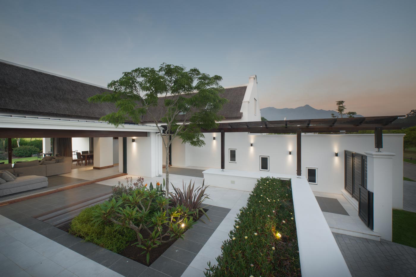 Modern home courtyard at twilight
