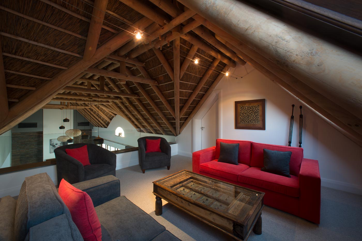 Loft with exposed trusses in estate home, South Africa
