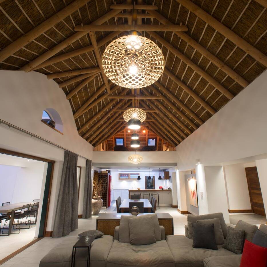 Feature exposed trusses and roof detail in southern cape golf estate home