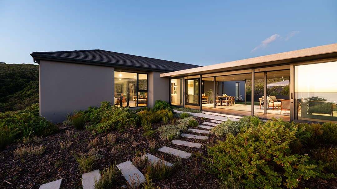 Courtyard garden with stepping paths and indigenous planting at House 1418