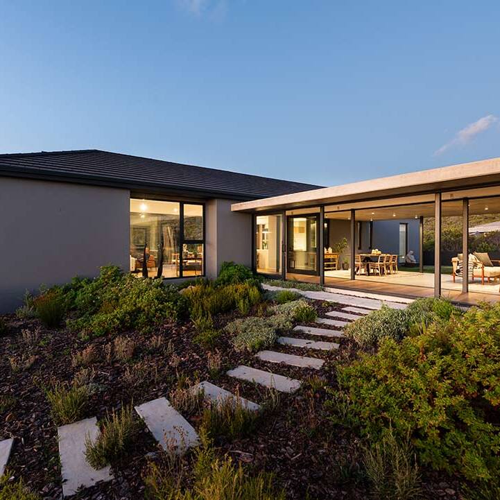 Courtyard garden with stepping paths and indigenous planting at House 1418