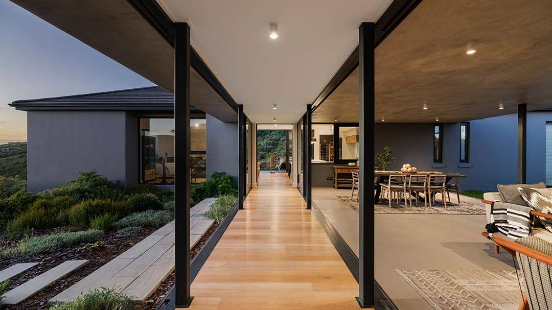 Glass-walled corridor linking two wings and opening to covered stoep, House 1418