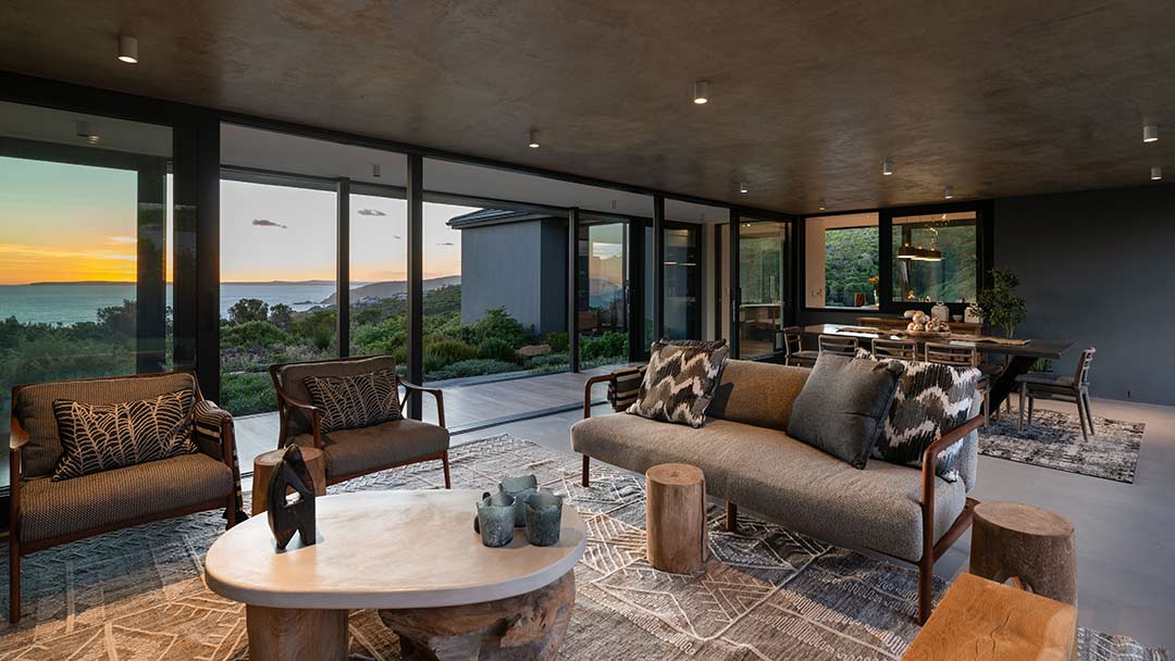 Open-plan courtyard framing sunset ocean views, House 1418