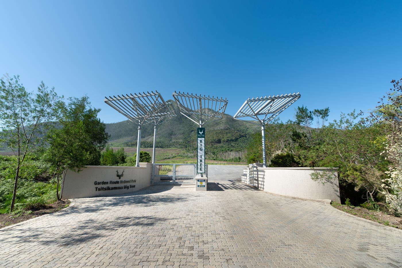 Main gate with sculptural steel shade structures and mountain view, Commercial Architecture Eastern Cape